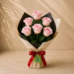 A bouquet of 6 pale-pink roses