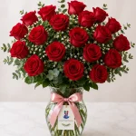 A vase arrangement of 20 red roses