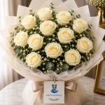 A bouquet of 12 white roses