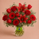 A vase arrangement featuring 13 main blooms