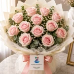A bouquet of 12 light pink roses